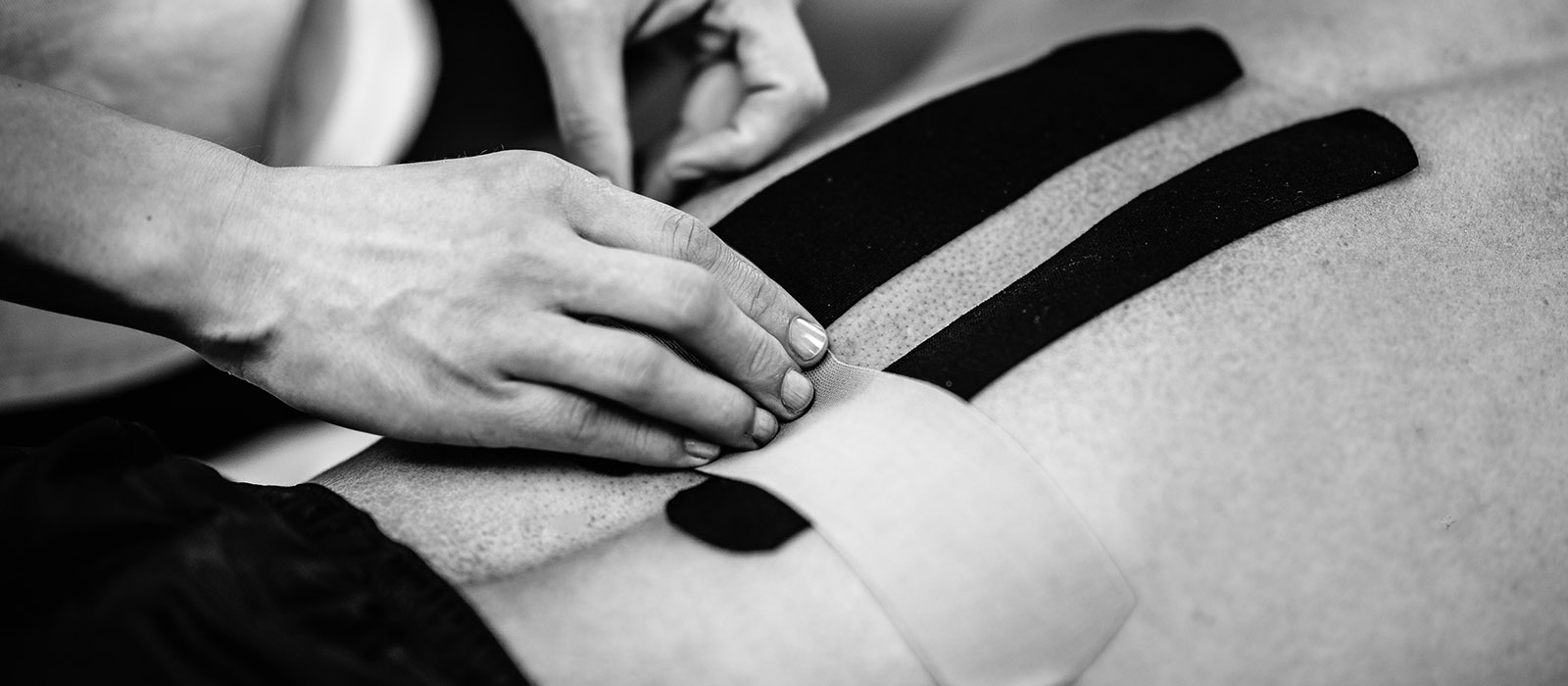 Physical therapist applying kinesio taping
